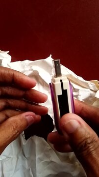 Purple USB Flash Drive on Wrinkled White Paper Background