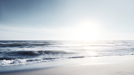 A serene beach scene with gentle waves and an empty shoreline, evoking tranquility.