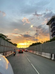 Bangkok sunset, Victory Monument, City street at dusk, Evening commute traffic