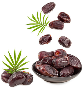 fresh date fruits with green leaves isolated on white background. clipping path