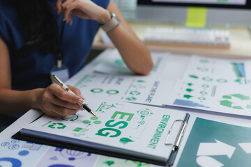 Manager analyzing esg environmental social and corporate governance key performance indicators