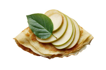 A golden crepe topped with sliced pears and a leaf