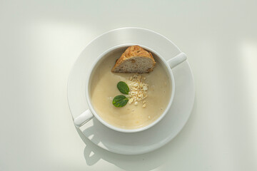 Cream of mushroom soup in a white ceramic bowl