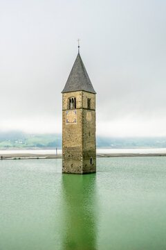 Historic Alt-Grauner church tower emerging from Reschensee in South Tyrol