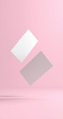 Fototapeta premium Two blank business cards, white and light gray, levitate against a soft pink background
