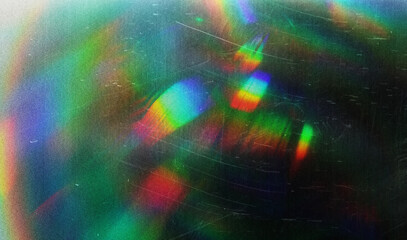 Blur colorful rainbow crystal light leaks on black background. Defocused abstract multicolored...