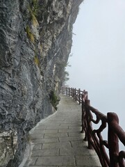 walk along the path below a cliff