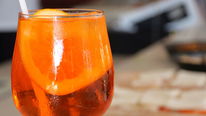 Refreshing Spritz Cocktail with Orange Slice Perfect for Relaxing Bar Moments Enjoying a Sunny...