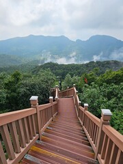 a mountain view under the stairs; a sky cloud