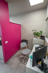 Modern medical office reception with sleek desk, computer, and welcoming atmosphere