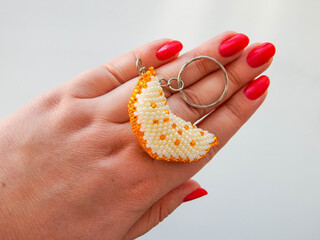 Portrait of hand with key chain with slice shape