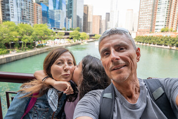 A happy family enjoys the view of Chicago on a hot summer day