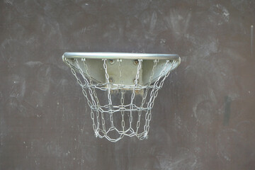 Metal basketball hoop with chains - silver and neutral dark background