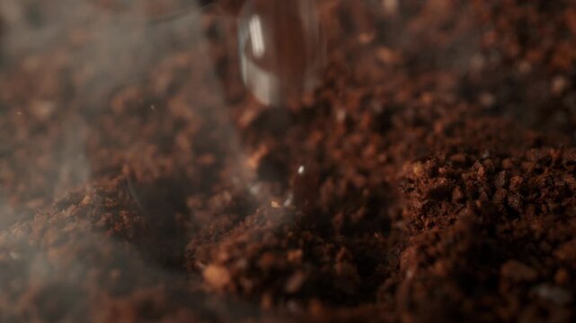 Super Slow Motion Detail Shot of Brewing Ground Coffee with Hot Water at 1000fps.