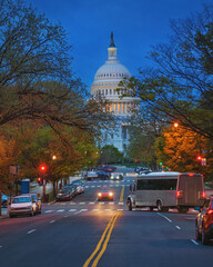  Road leads to US Capitol building at sunset, frontal view, Washington DC, USA.