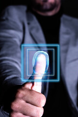 A man is pointing to a square with a finger, and the square is glowing blue