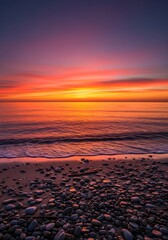 Obraz premium Beautiful sunset over the sea with colorful sky and rocks on the beach at dusk