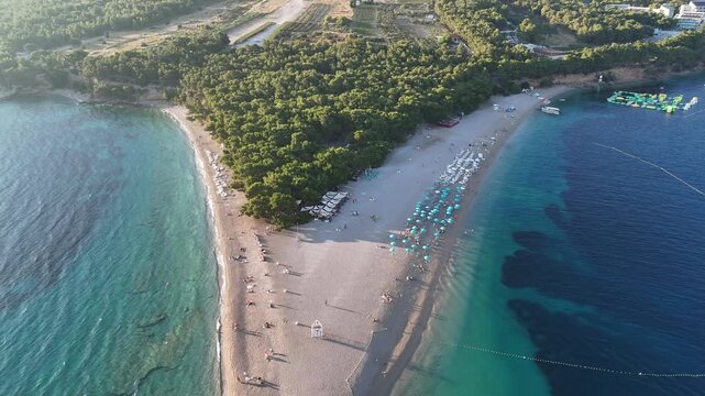 Aerial drone birds eye view of bol Brač croatian island tourist coastal town city croatia adriatic sea zlatni rat golden horn beach