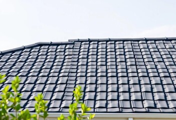 Sleek grey interlocking tiles on a contemporary home roof, modern roof, roofline