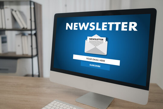 Newsletter subscription concept with modern computer on office desk, showing email signup form on screen for marketing, business communication, and audience engagement in digital workspace.
