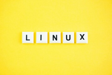 letters of the alphabet with the word linux and yellow background. Internet concept. Linux is a...