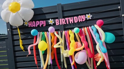 A Vibrant and Colorful Birthday Decoration Setup Featuring Balloons, Streamers, and Festive Elements