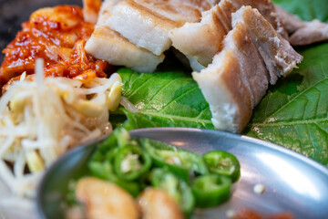Korean Ssam with Grilled Pork Belly, Kimchi, and Side Dishes