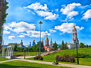 Colorful architecture in a serene park setting under a bright blue sky in summer