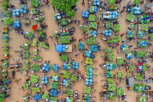 Kansat, Bangladesh - 15 June 2019: Aerial view of vibrant market scene, where farmers display their produce in lush green stacks, creating a captivating mosaic of agriculture.