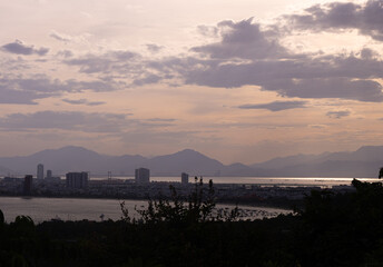 Sunset Skyline of Da Nang with Mountains and Harbor View

