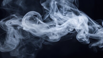 A close-up view of a puff of white smoke, showcasing its soft, fluffy texture and delicate, wispy edges. Set against a black background, the smoke tapers gently
