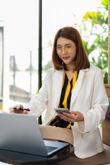 lifestyle of office workers, Woman successful calculating expenses and using laptop. Home office....