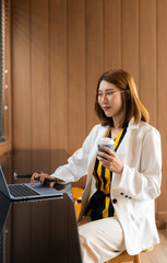 lifestyle of office workers, Woman successful calculating expenses and using laptop. Home office....