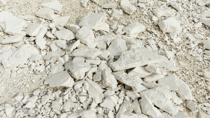 Pokrovsky Cretaceous mountains. White rocky terrain with scattered pieces of limestone, showcasing...