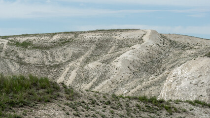 Pokrovsky Cretaceous mountains. Expansive view of rugged terrain showcasing rolling hills and...