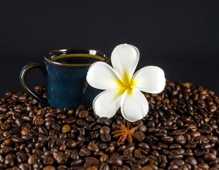 Coffee cup with flower and coffee beans