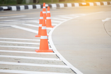 Orange Traffic Cone on Empty Asphalt Road