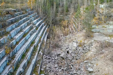 old marble quarry overgrown with trees.