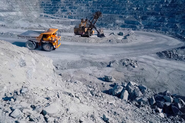 Quarry equipment for extraction and transportation of granite, dump trucks and excavators