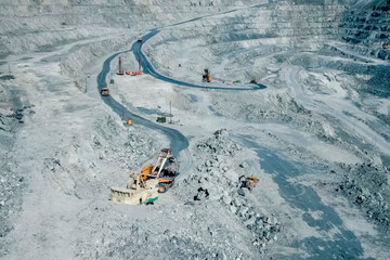 Quarry equipment for extraction and transportation of granite, dump trucks and excavators