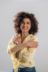 Happy, positive facial expression. Beautiful woman is in the studio