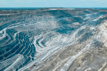 view from above of a huge asbestos quarry, the mined-out slopes