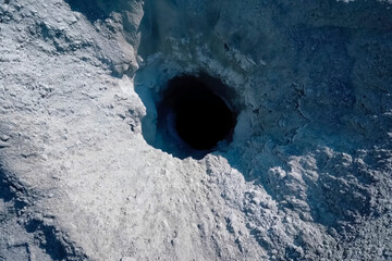 Wellhead of a drilled well in rock