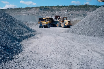 Loading and transportation of stone chips on dump trucks in quarry