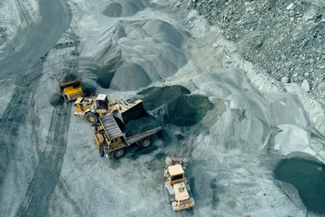 Loading and transportation of stone chips on dump trucks in quarry