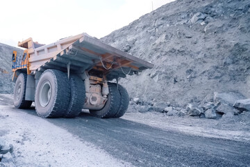 larger mining dump truck in the quarry against the background of