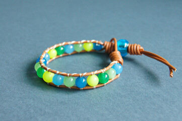 Chan Lu-style braided leather bracelet with green and blue jade beads