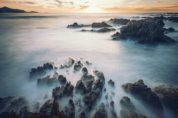 Rocks at the beach of Ostriconi, Corse, France after a storm. Long exposure with ND filter.