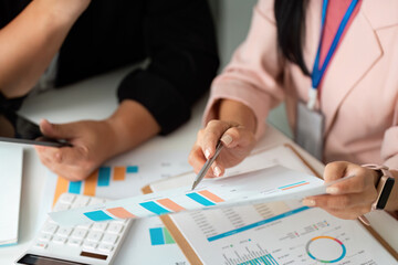 Data Analysis. Professionals reviewing financial reports in a meeting.