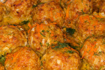Rice meatballs stewed with red sauce, close-up selective focus